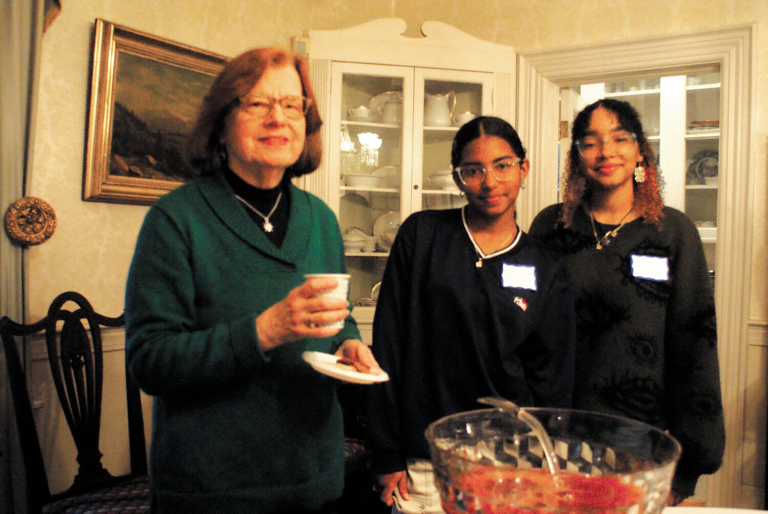 SHARING SOME PUNCH: President of the Cranston Historical Society Sandra Moyer taking a moment to rest with sister volunteers from Cranston East Willy and Wilmary Hunt.